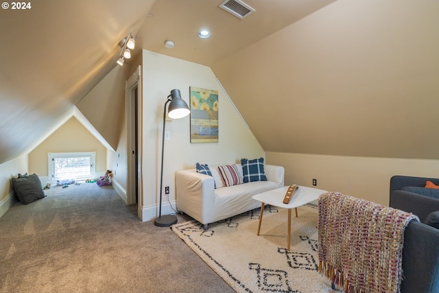 living area featuring lofted ceiling and carpet flooring