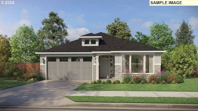 view of front of property with a garage and a front lawn