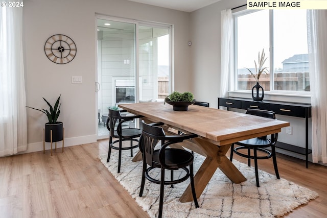 dining area with light hardwood / wood-style flooring