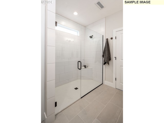 bathroom featuring tile patterned floors and walk in shower