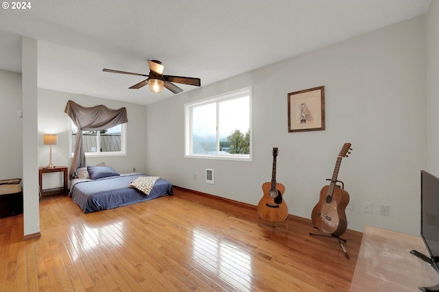 bedroom featuring ceiling fan and light wood-type flooring