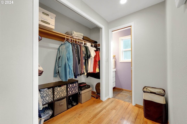 spacious closet featuring light wood-type flooring