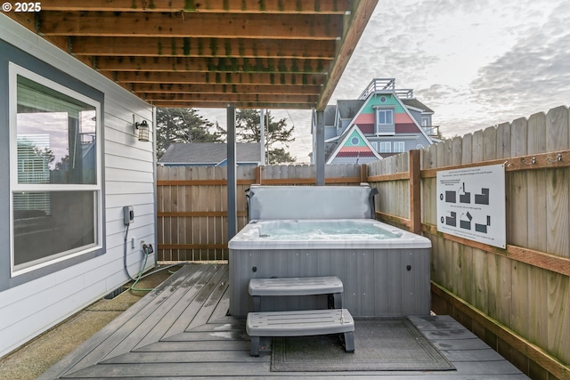 deck with a hot tub