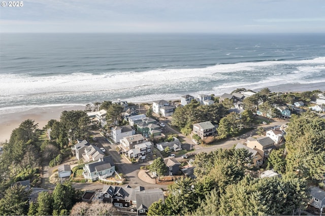 aerial view featuring a water view and a view of the beach