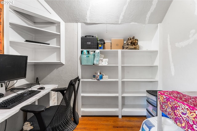 home office with wood finished floors