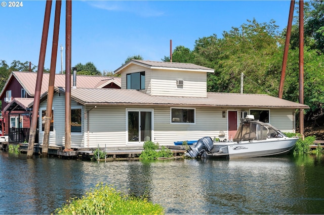 back of house with a water view