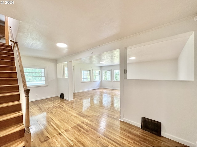 unfurnished living room featuring light wood-type flooring