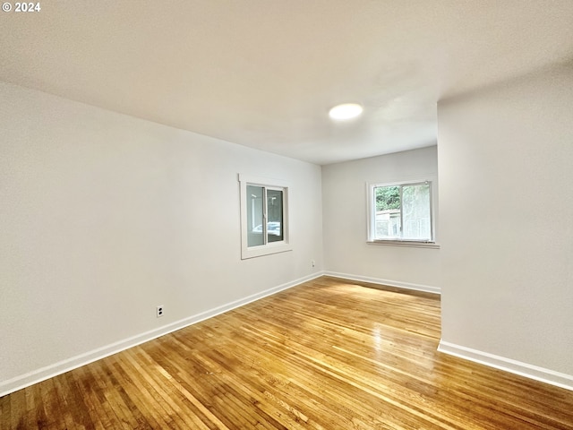 empty room with light hardwood / wood-style floors