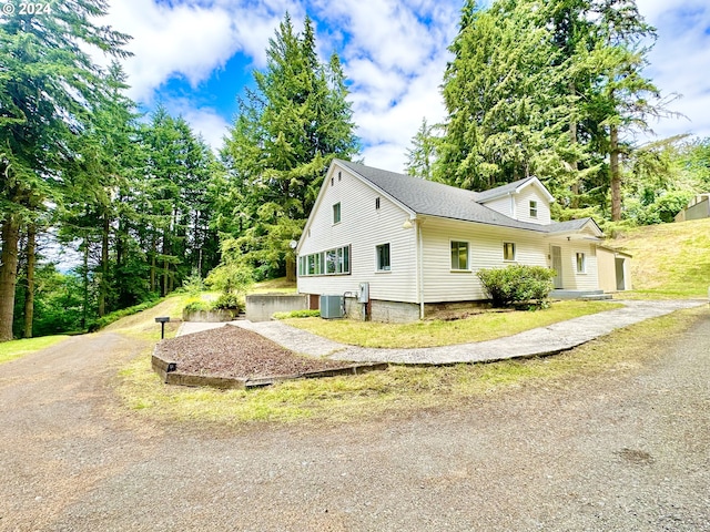 view of side of property with central AC