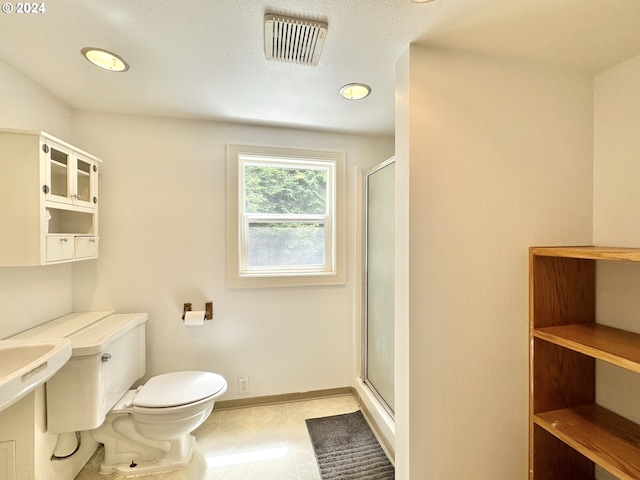 bathroom with toilet and walk in shower