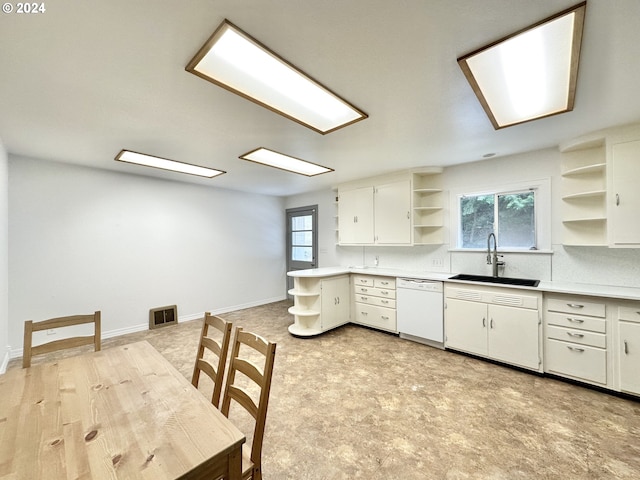 kitchen with dishwasher, white cabinetry, a healthy amount of sunlight, and sink