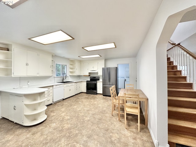 kitchen featuring stainless steel fridge, sink, dishwasher, white cabinetry, and black / electric stove