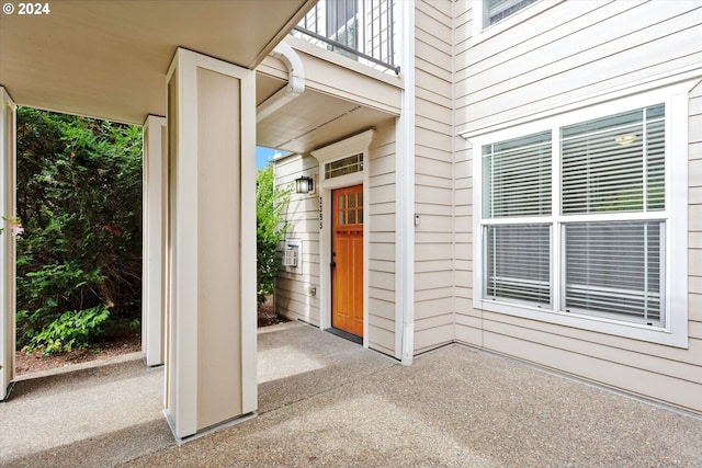 doorway to property featuring a balcony