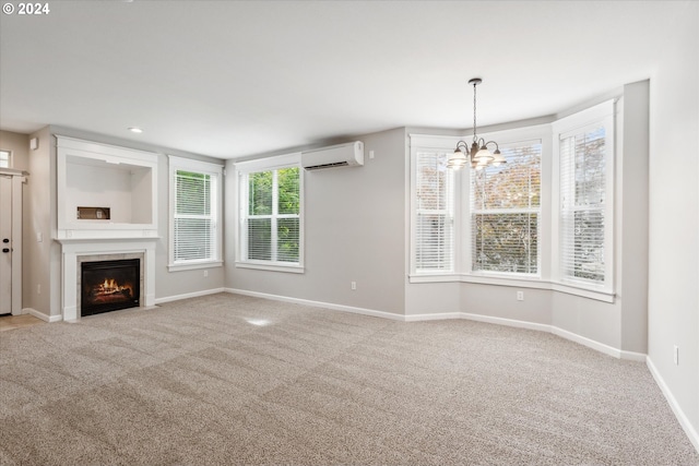 unfurnished living room with light colored carpet, a chandelier, and an AC wall unit