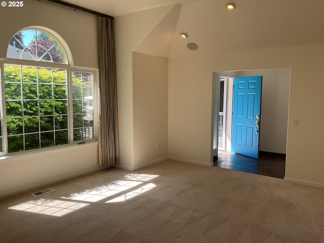 carpeted empty room with baseboards and recessed lighting