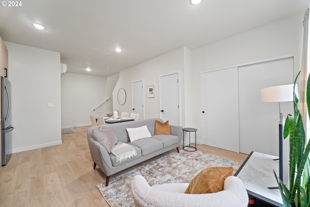 living room with light hardwood / wood-style flooring