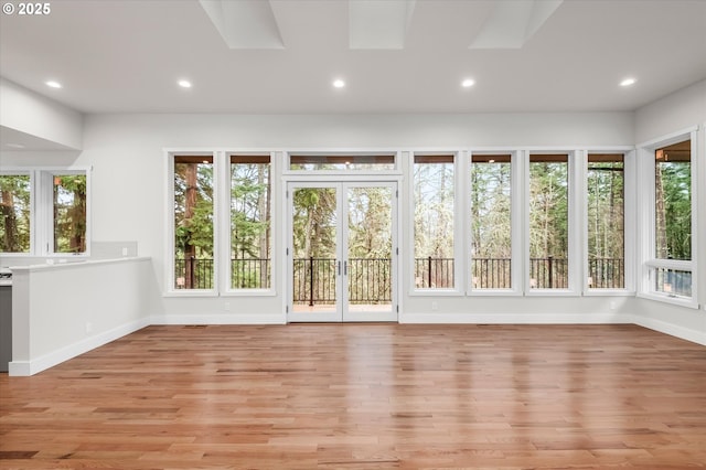 unfurnished sunroom with plenty of natural light