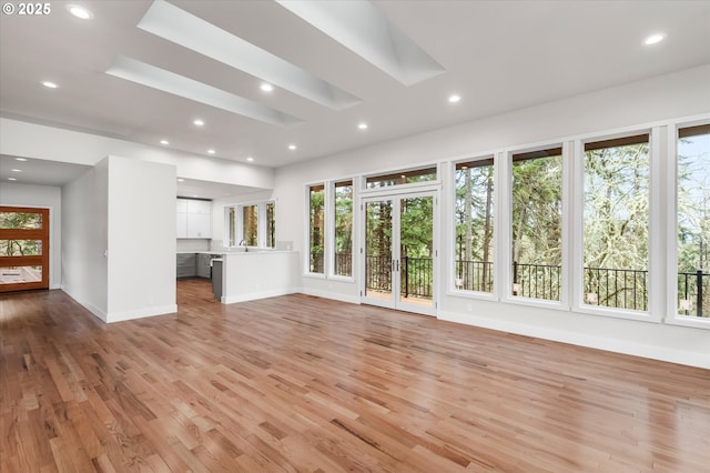 unfurnished living room featuring light hardwood / wood-style floors