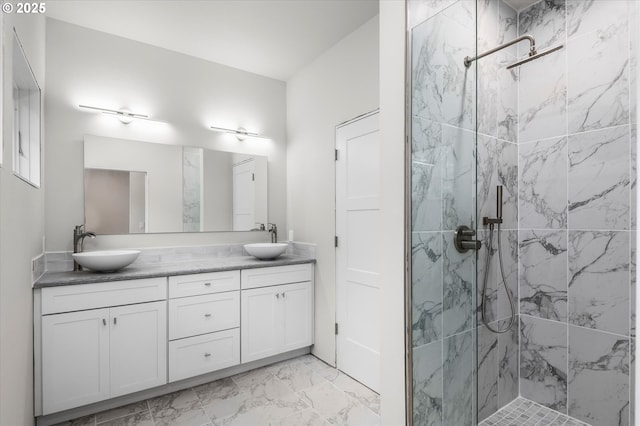 bathroom featuring vanity and a tile shower