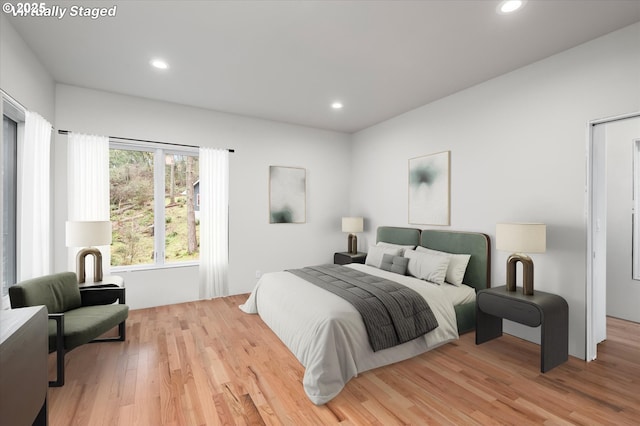 bedroom with light hardwood / wood-style flooring