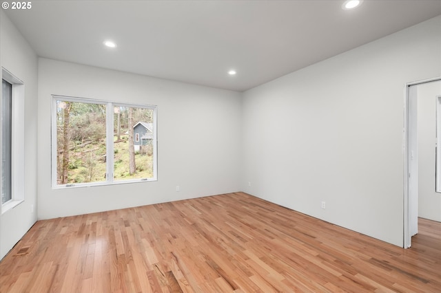 spare room featuring light hardwood / wood-style floors