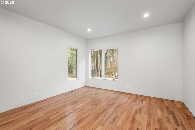 spare room with light wood-type flooring