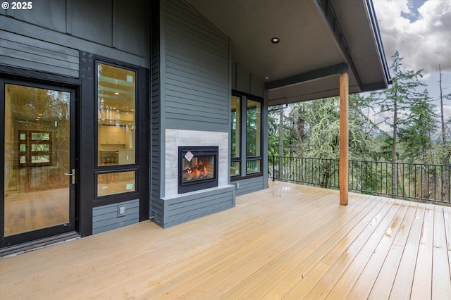 deck featuring a large fireplace