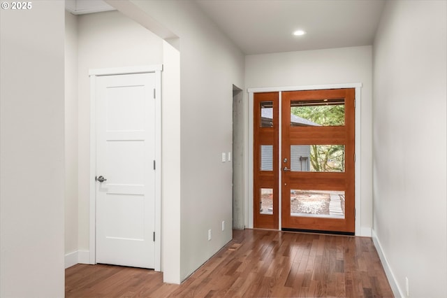 foyer entrance with hardwood / wood-style floors