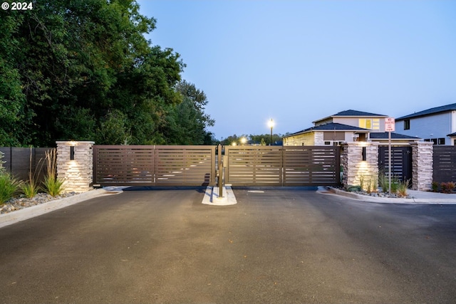 view of gate featuring fence