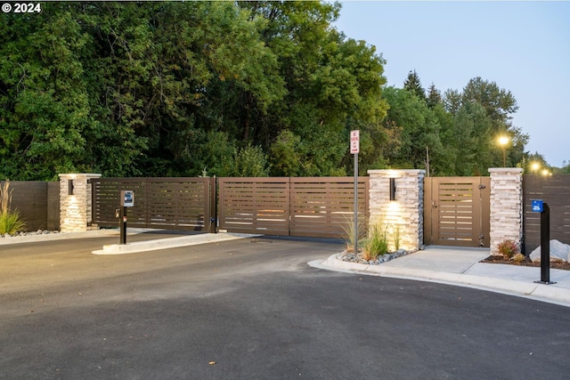 view of gate with fence