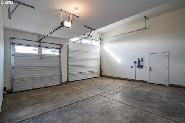 garage with electric panel, baseboards, and a garage door opener