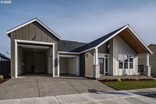 view of front of home featuring board and batten siding, concrete driveway, and an attached garage