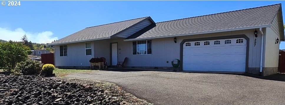 single story home with a garage