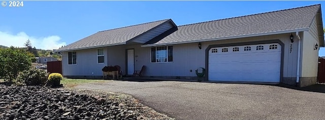 single story home with a garage