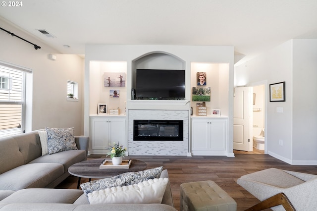 living room featuring dark hardwood / wood-style flooring