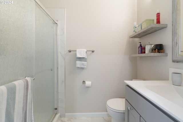 bathroom with toilet, a shower with door, and vanity