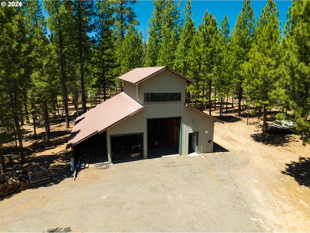 front of property with a garage and an outdoor structure