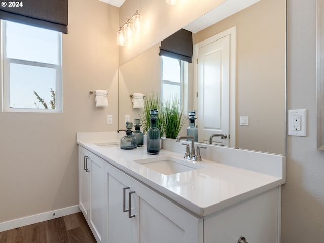 bathroom featuring vanity and hardwood / wood-style flooring