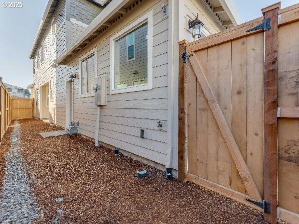 view of home's exterior featuring fence