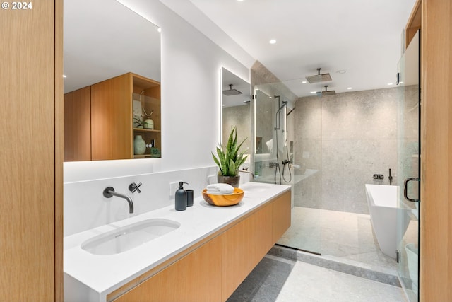 bathroom with independent shower and bath and vanity