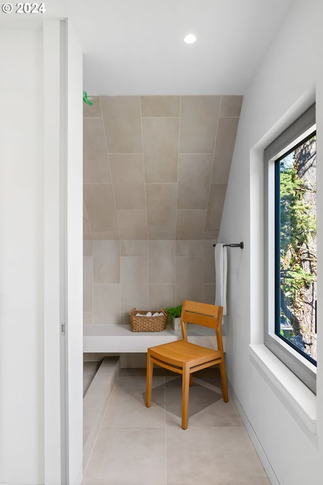 interior space featuring tile walls