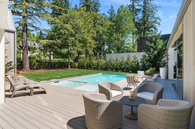 view of pool featuring a deck and a yard