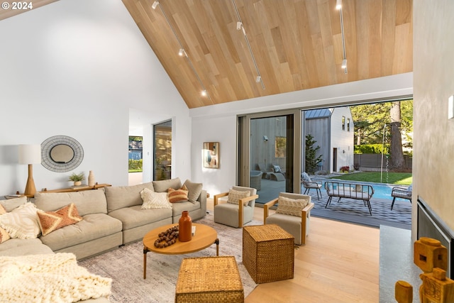 living room featuring light wood-type flooring, high vaulted ceiling, and wooden ceiling