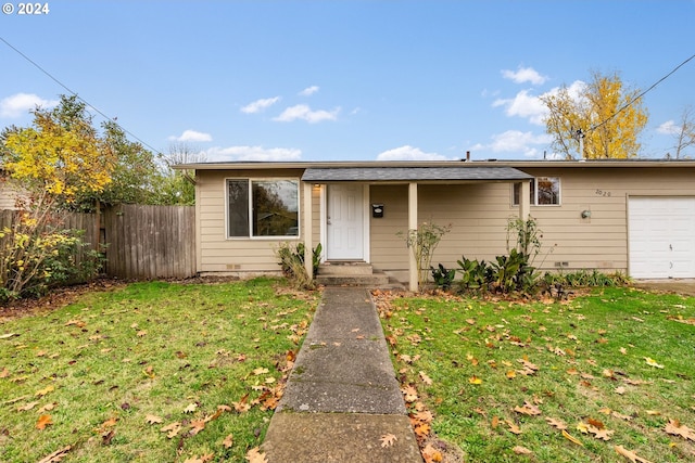 view of front facade featuring a garage and a front yard