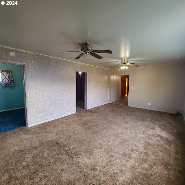 carpeted empty room with ceiling fan