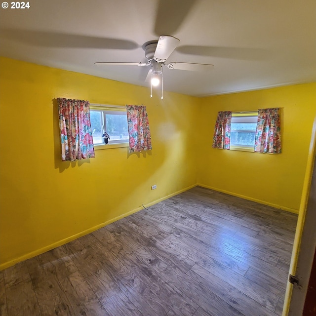 unfurnished room featuring ceiling fan and hardwood / wood-style flooring