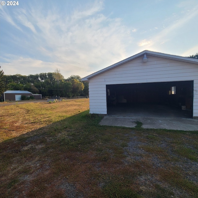 garage featuring a yard