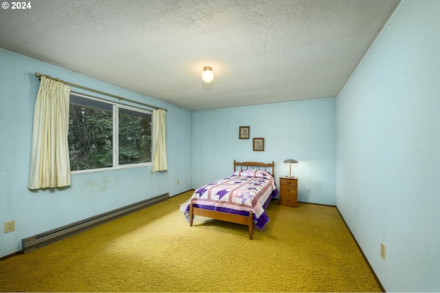 bedroom with carpet, a textured ceiling, and a baseboard radiator