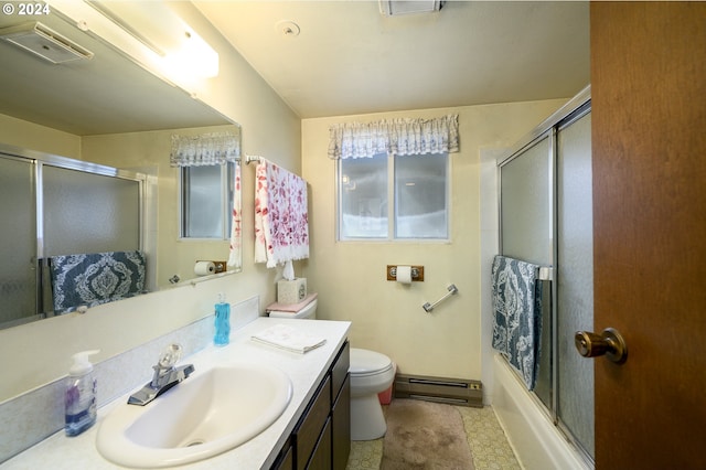 full bathroom with tile patterned floors, vanity, a baseboard heating unit, shower / bath combination with glass door, and toilet