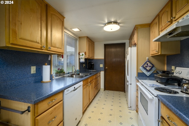 kitchen featuring white appliances and sink